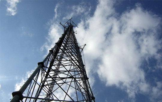 Acquisitions case study with a telecoms tower looking up